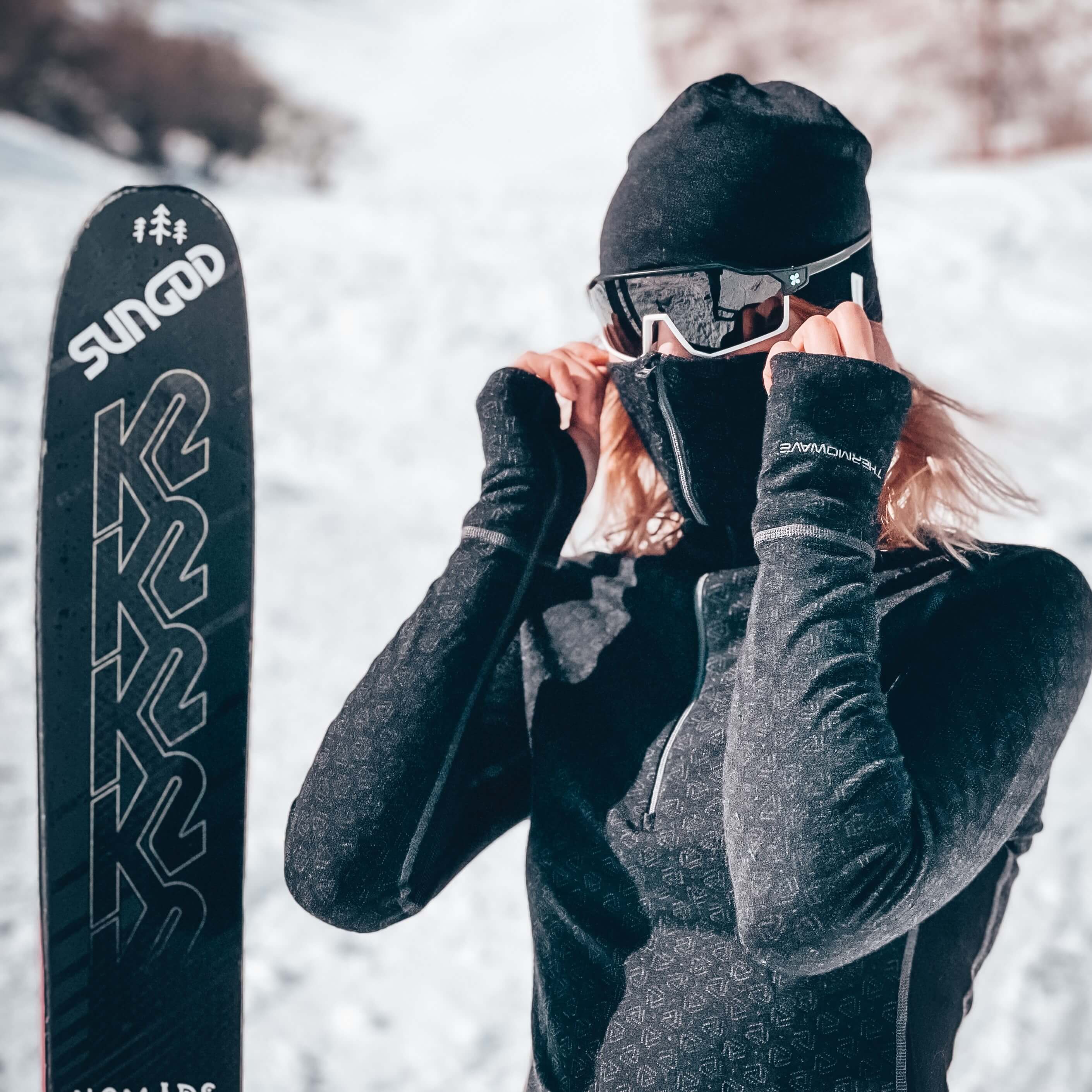female-skier-in-the-mountains-with-thermal-clothes-and-ski-goggles